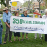 Mel's photo of new banner with members in Colorado Springs
