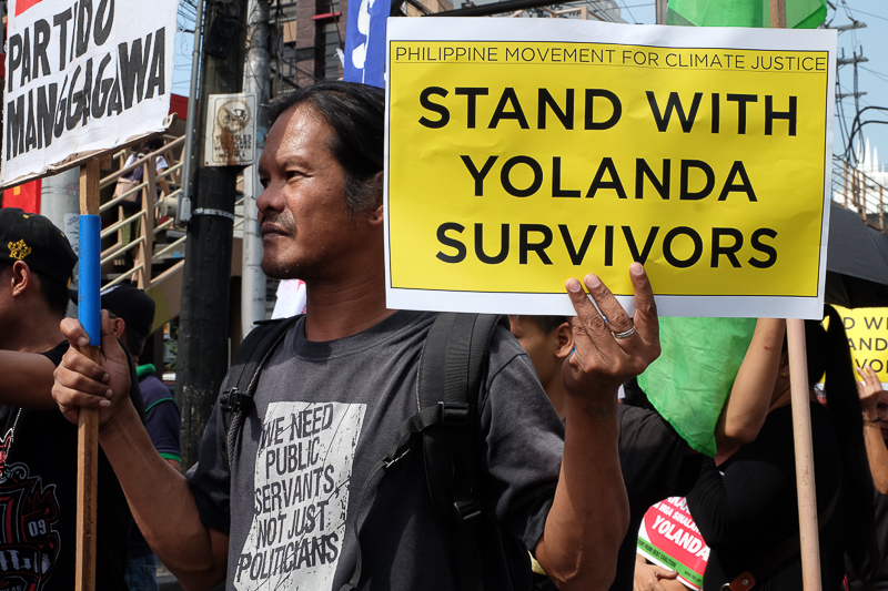 Climate activists from pay their respects to the casualties and survivors ofTyphoon Haiyan (Yolanda), which devastated central Philippines 3 years ago at a solidarity march that was hod in Mendiola, Manila where the groups also reiterated their call for climate justice, to the leaders gathering for the 22nd conference of parties happening in Marakech, Morocco. Photo: AC Dimatatac