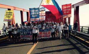 Photo of the Climate Walker as they crossed over San Juanico Bridge to enter Tacloban. Photo by: Chuck Baclagon