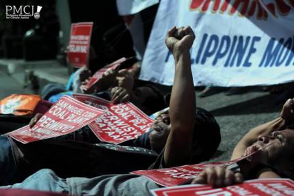 Activists and community representatives lead by the Philippine Movement for Climate Justice hold protest against SMC Consolidated Power Corporation in their company headquarters in Manila. Photo: PMCJ