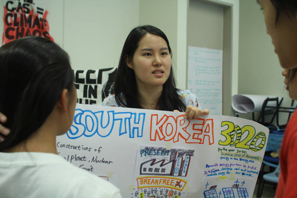 A member of South Korea environmental group GEYK  sharing the future goals of Korea’s Energiewende Photo credit: Silver