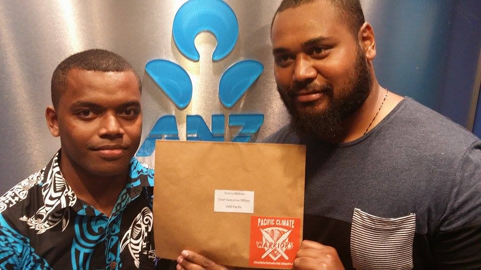 Fijian Climate Warrior, George Nacewa, delivers a letter to ANZ management