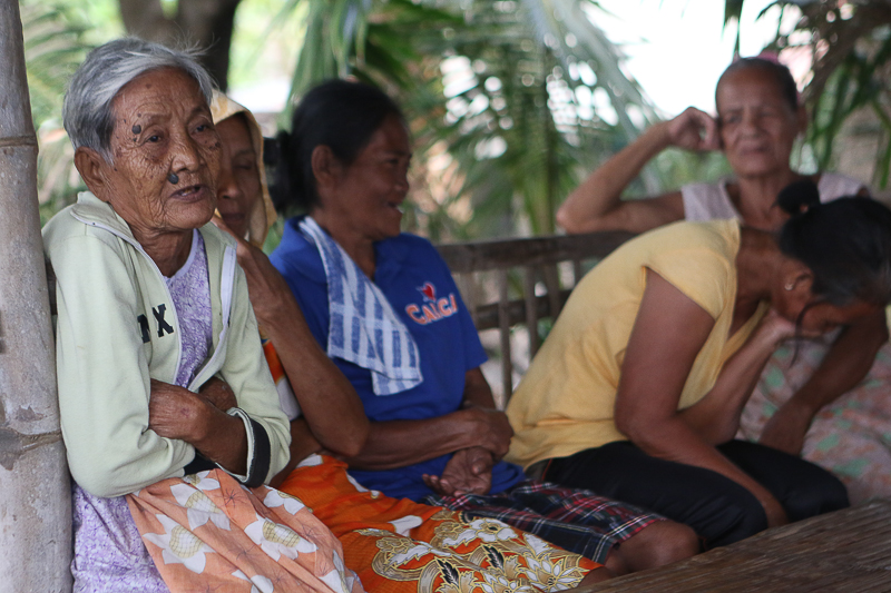 Elders of the Barangay Quisumbing share their experiences about the coal power plant near their area. © AC Dimatatac