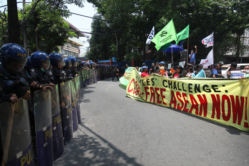 Activists are met by a throng of policemen as they try to march towards the venue of the Association aof Southeast Asian Nations (ASEAN) meetings in Manila on April 28, 2017 to demand their leaders to end all coal projects and commit to renewable energy. Southeast Asia remains a global coal hotspot despite drastic reductions in renewable energy costs and the region's vulnerability to climate change. (Photo: RB Ibañez/350.org)