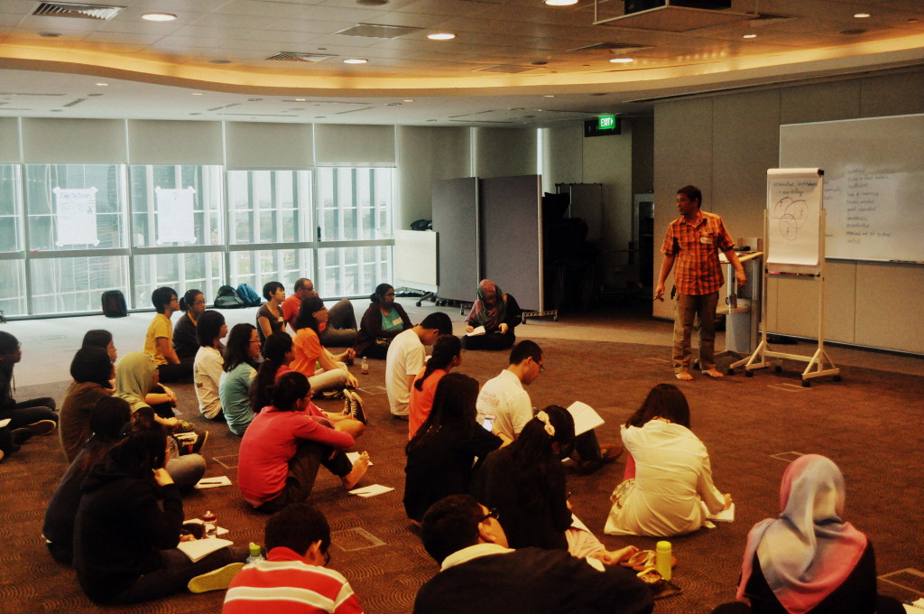 Participants listening intently to Joseph Dela Cruz of Climate Actions Network International for their campaigning workshop
